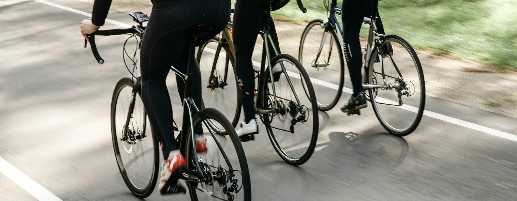 a group of people riding bikes