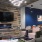 community lounge with fireplace and tv